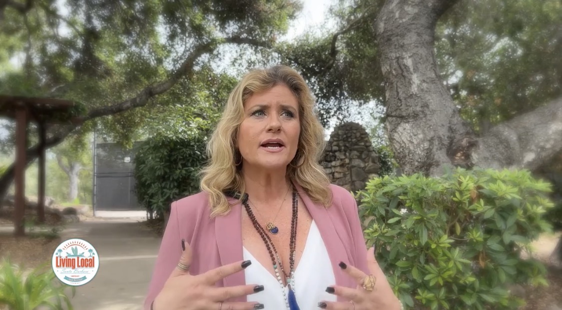 Alicia Journey actively explaining an idea during an outdoor television interview